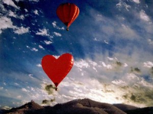 love is in the air -- heart-shaped hot air balloons in the sky