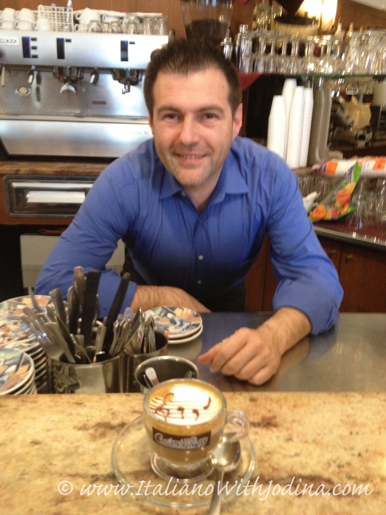a barrista in Piedmont serves cappuccino