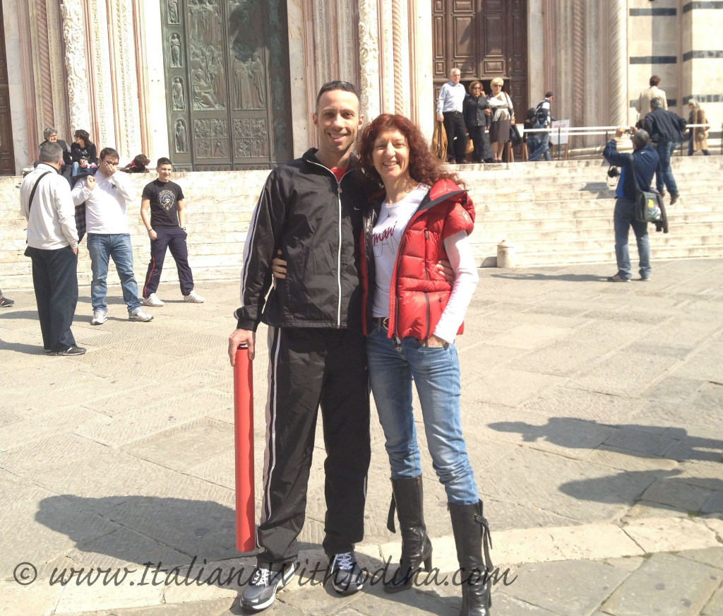 an italian couple poses in piazza duomo